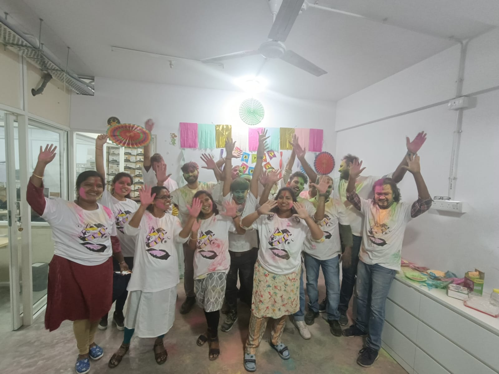 Gajra New Energy team celebrating Holi indoors