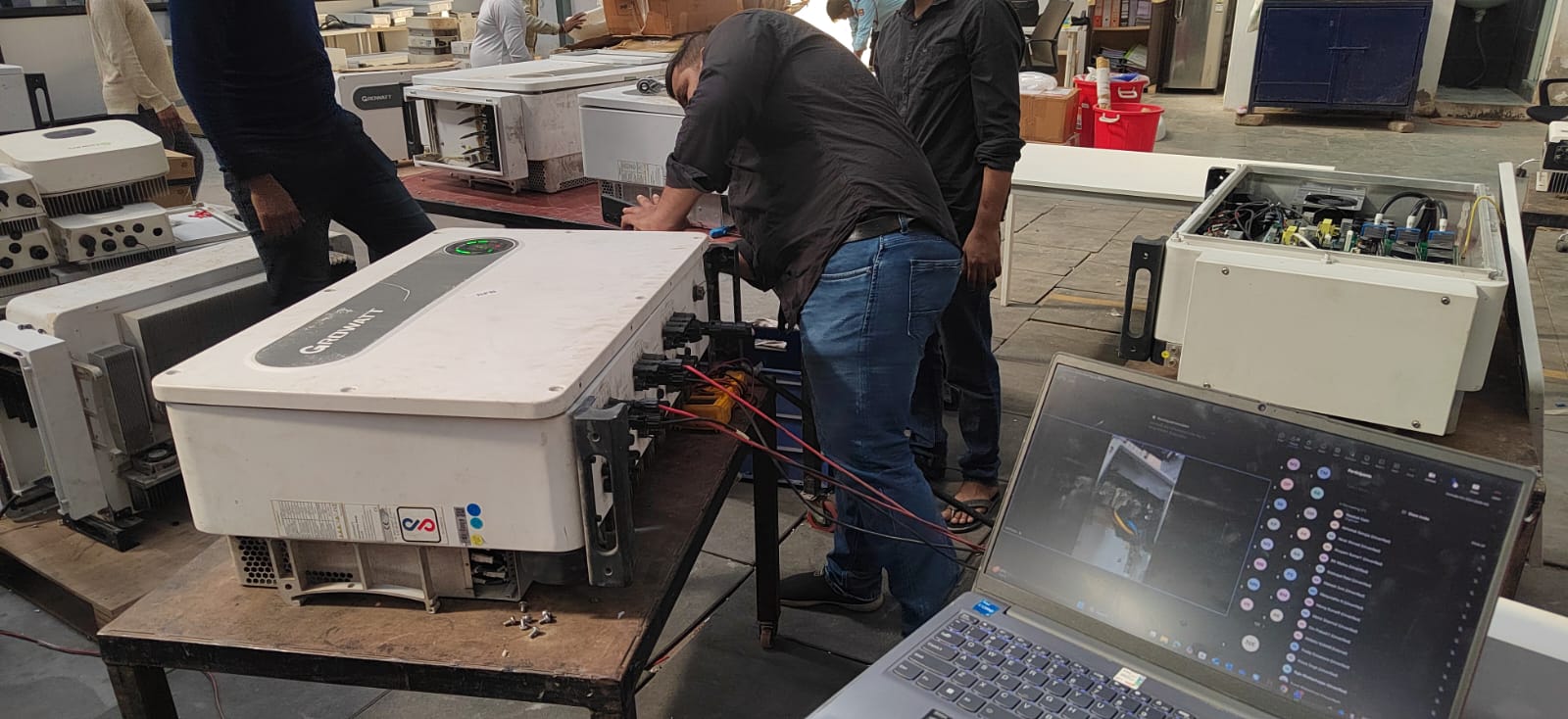 Laptop and repair bench used during live inverter diagnosis