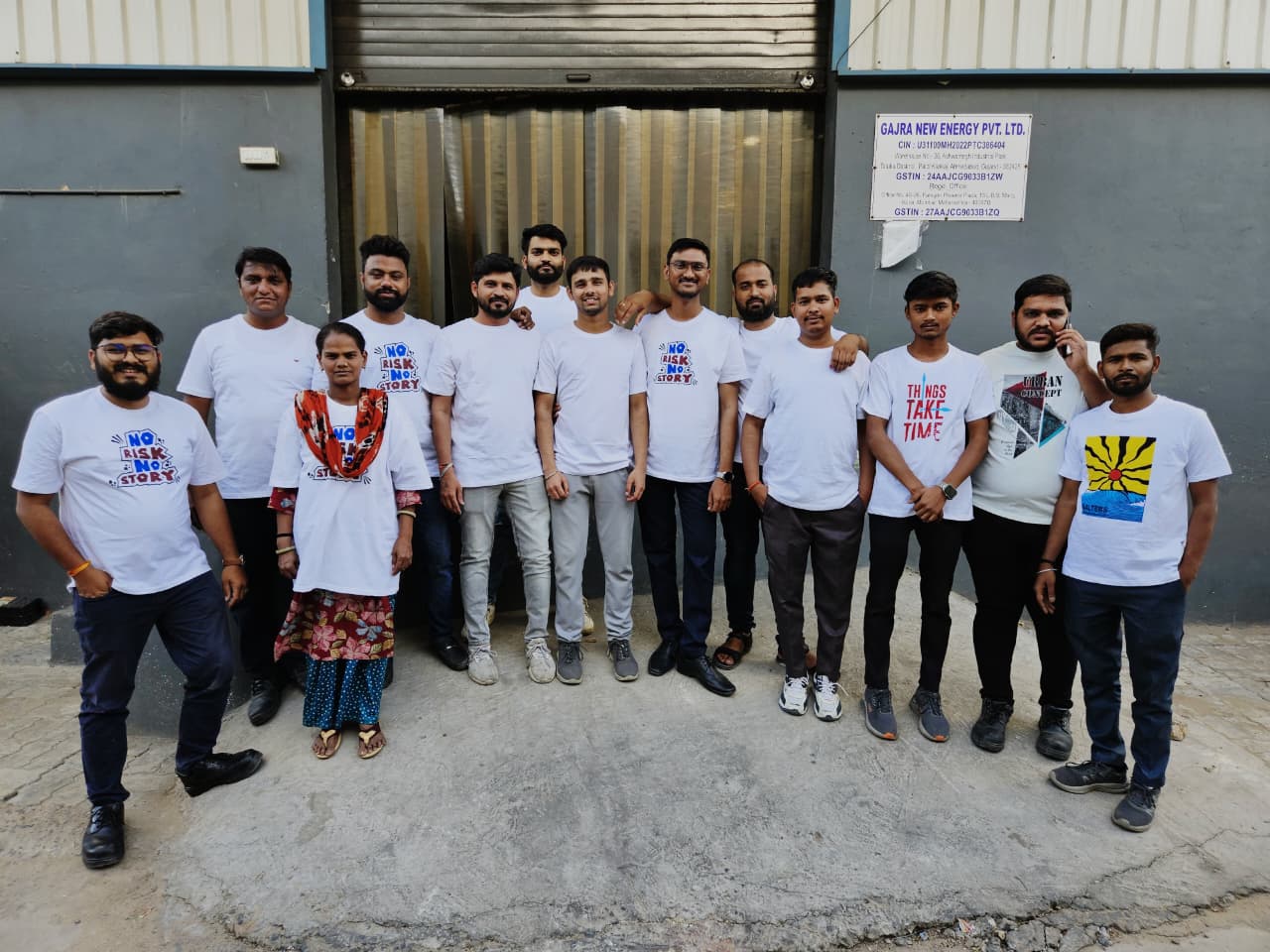 Team in white t shirts standing together outside the Gajra New Energy premises